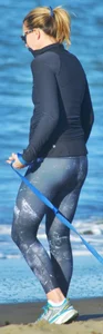 Beach redhead milf in patterened leggings at the beach