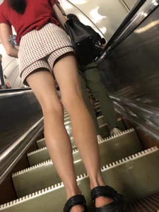 Amazing Long And Slim Legs of a Candid Girl Standing on the Subway Escalator