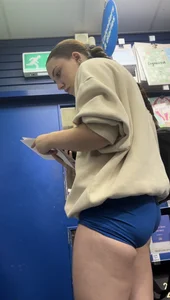 Stunning cheeked up gym girl shopping in blue shorts (OC)