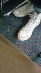 High School Girl's Sneakers Closeup in Classroom Candid Closeup Photo