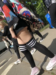An Anime Fan Teen in a Short Skirt And Stockings Bending Over on the Crosswalk Street Creepshots