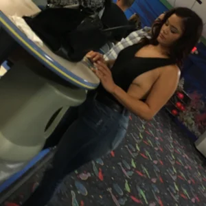 Thick brunette in tight jeans and showing some side boob