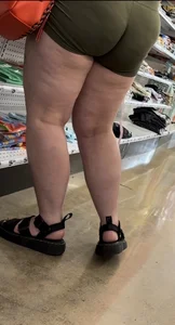 Juicy brunette in green spandex shorts OC