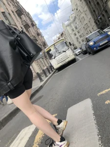 Very hot legs of a candid girl wearing a leather jacket