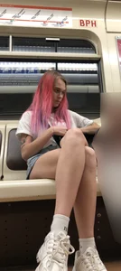 Girl With Pink Hair and Hot Legs in Denim Shorts in the Subway Train Candid Photo Gallery