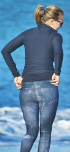 Beach redhead milf in patterened leggings at the beach