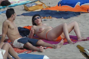 Girls on a nude beach in Sitges, Spain