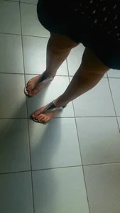 Young Girl's Feet With a Pink Pedicure in Sandals Closeup Photos Collection