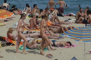 Topless girls on a beach in Barcelona