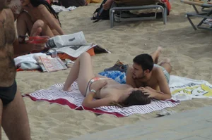 Topless girls on a beach in Barcelona