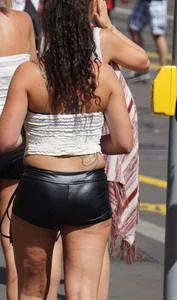 Girl out in tiny little leather shorts with a decent ass