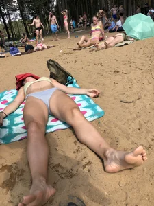 Girl Sleeping on a Beach With Spread Legs Photo