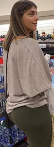 Candid girl in leggings at the grocery store photo