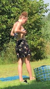 Sexy teen on the beach changing
