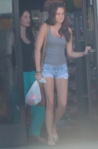 Beautiful tall teen in short denim shorts