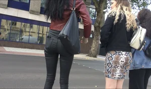 Chav brunette with a nice ass and vpl in tight black leather pants