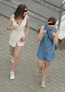 Downblouse closeup of a hot candid girl passing by on the street