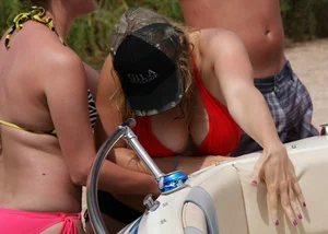 Big boobed blonde in red top bikini with nice cleavage