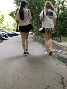 Couple of candid teens walking down the street