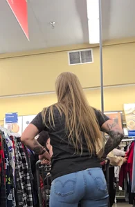 Girl with tattoos in tight jeans