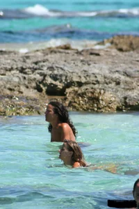 Nude beach ladies in the water showing their tits