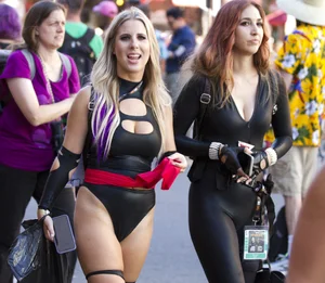 Sexy candid cosplayers wearing costumes at a con