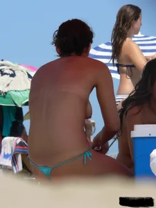 2 topless thonged sexy friends on the beach with great bodies