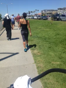 Hot brunette babe in leggings walking her dog with a nice ass and some cleavage