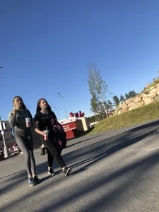 Skinny Girl in Grey Leggings Walking Past the Camera Candid Photos Gallery