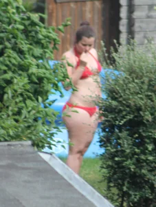 Thick babe in the backyard in red bikini