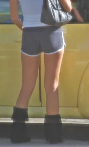 Skinny babe going to her car in little cotton shorts