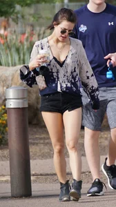 Cutie walking her dog in short denim shorts and showing a bit of cheek