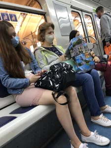 Cute Candid Girl in a Face Mask Sitting in a Subway Train - Thin Sexy Legs