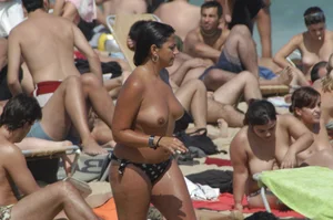 Topless girls on a beach in Barcelona