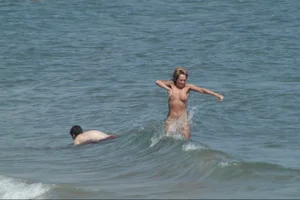 Girls on a nude beach in Sitges, Spain