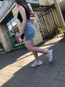 Hot chick wearing a fringed skirt walking up the stairs