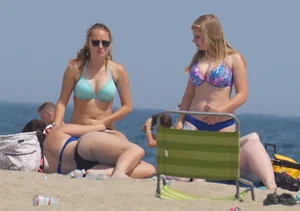 3 girls on the beach in bikinis with big boobs, one brunette and two blondes