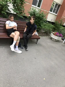 Stocky candid girl sitting on a bench on the street