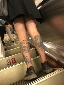 Candid Girl in a Skirt With Skinny Legs With Tattooed Calves Subway Escalator Low Angle Creepshot