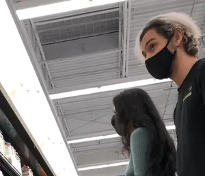 Tight green top and blk jeans at the market