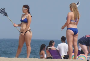 3 girls on the beach in bikinis with big boobs, one brunette and two blondes