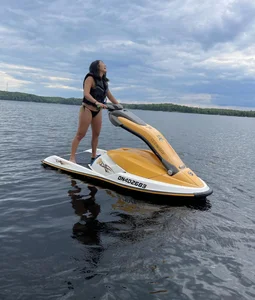 Hot Girl in a Swimsuit on a Motorboat