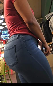 Thick ebony booty in tight jeans.