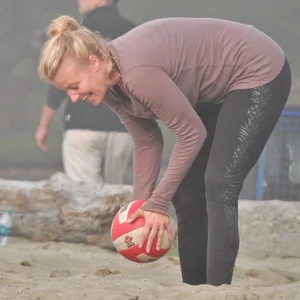 Beach volleyball blonde lady in tight leggings
