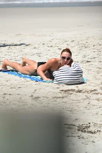Redhead with nice tits in a bikini on the beach