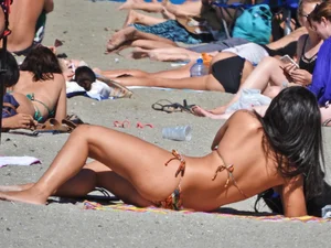 Pretty brunette in a bikini at the beach
