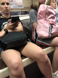 Candid Girl in Shorts Sitting in Subway Train Photos