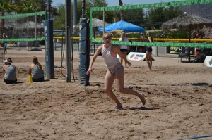 Beach volleyball blonde looking sexy and showing her body off