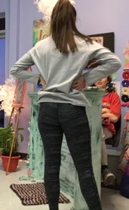 Ass standing around in tight grey patterned leggings