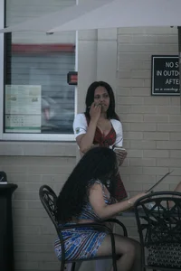 Two sexy Tilted Kilt employees showing cleavage and cheeks